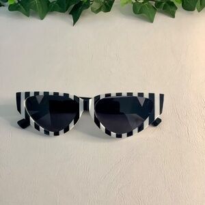 Women stylist black and white sunglasses. Small frames